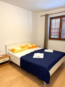 Posteľ alebo postele v izbe v ubytovaní Apartment Gitara