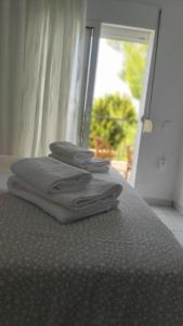 Posteľ alebo postele v izbe v ubytovaní Sun 'n Sand, dream it in Possidi
