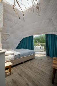 Postel nebo postele na pokoji v ubytování Glamping Machakhela