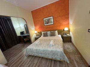 Postel nebo postele na pokoji v ubytování Hotel Raffaello Venice