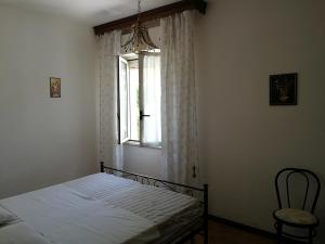 En eller flere senge i et værelse på Casa Valentina ANIMALI NON AMMESSI