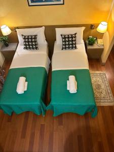 Postel nebo postele na pokoji v ubytování Hotel Raffaello Venice
