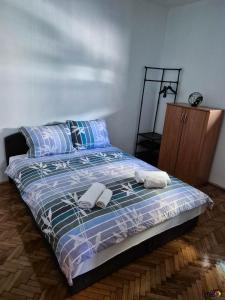 Ένα ή περισσότερα κρεβάτια σε δωμάτιο στο M&M Drvar