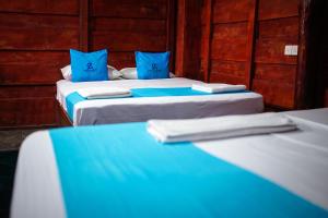 Postel nebo postele na pokoji v ubytování Ceylon Amigos Eco Resort