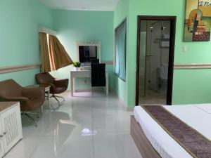 Postel nebo postele na pokoji v ubytování Fortune 1127 - Central Hotel