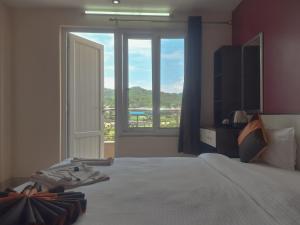 Hotel Royal Inn Batar客房内的一张或多张床位