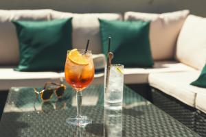 a drink on a glass table on a couch at Stoke Lodge Hotel in Stoke Fleming