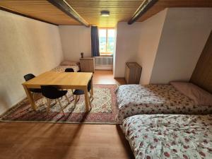 En eller flere senger på et rom på Chambre d'Hôtes R&S