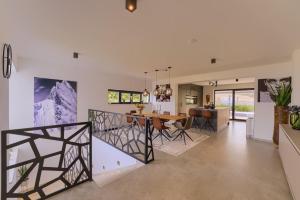 a dining room and kitchen with a dining table and chairs at Apartment Villa Dolce Vita Korcula in Lumbarda