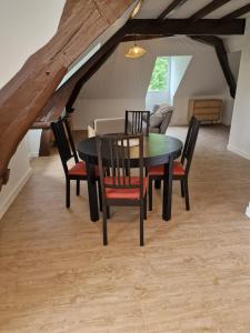 a dining room with a table and chairs at Château de Sérignac in Malemort-sur-Corrèze