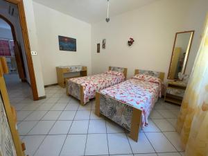 Postel nebo postele na pokoji v ubytování Villa Muntiranni