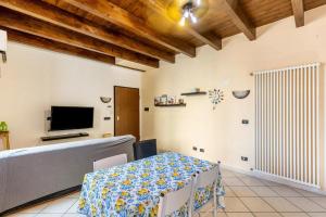 Televízia a/alebo spoločenská miestnosť v ubytovaní House Verona Zen