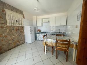 Kuchyň nebo kuchyňský kout v ubytování Villa Muntiranni