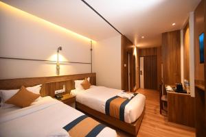 Postelja oz. postelje v sobi nastanitve Hotel Vistara