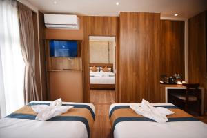 Postelja oz. postelje v sobi nastanitve Hotel Vistara