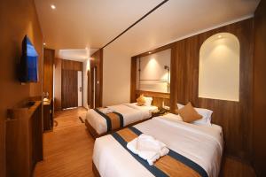 Postelja oz. postelje v sobi nastanitve Hotel Vistara