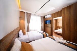 Postelja oz. postelje v sobi nastanitve Hotel Vistara