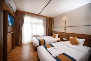 Postelja oz. postelje v sobi nastanitve Hotel Vistara