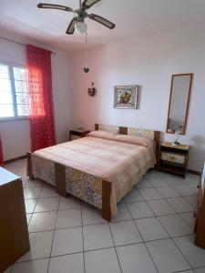Postel nebo postele na pokoji v ubytování Villa Muntiranni