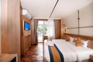 Postelja oz. postelje v sobi nastanitve Hotel Vistara