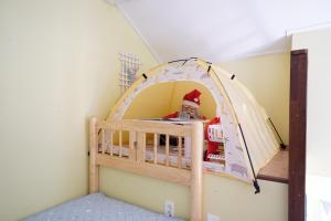 Postel nebo postele na pokoji v ubytování 철없는펜션