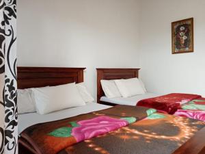 Postel nebo postele na pokoji v ubytování Kadalla Cottage + 37 fotografií