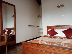 Postel nebo postele na pokoji v ubytování Kadalla Cottage