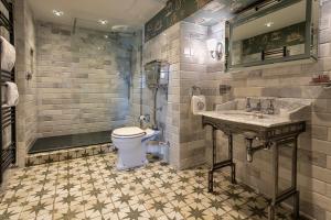a bathroom with a toilet and a sink at Georgian House Hotel in Whitehaven +97 photos