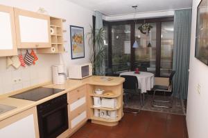 a kitchen with a table and a dining room at Fewo Steuer in Traben-Trarbach