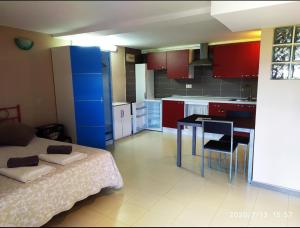 a kitchen with a bed and a table in a room at Vilar Norte in Bueu +66 photos