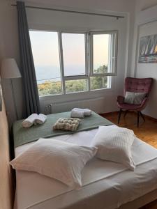 Postel nebo postele na pokoji v ubytování Anemos Apartment