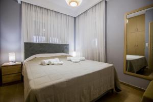 Postel nebo postele na pokoji v ubytování Villa Avra
