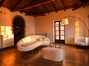 a bedroom with a large white bed in a room at Villa Oraia Verga Kalamata in Kalamata
