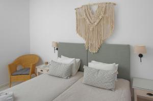 Кровать или кровати в номере Hotel Benois
