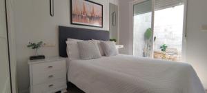 En eller flere senge i et værelse på Casa Pescadores Torrevieja