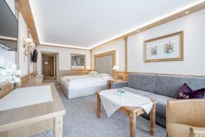 Postel nebo postele na pokoji v ubytování Hotel Bellevue - 4 Sterne superior