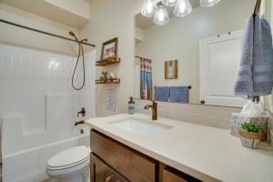 a bathroom with a sink and a toilet and a mirror at Lovely McCall Retreat Less Than 2 Mi to Payette Lake! in McCall +19 photos