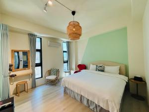 En eller flere senger på et rom på 宜蘭-讀好民宿 Read Nice House B&B 電梯民宿