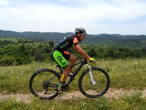 a man riding a bike on a hill at Nonna Nunzia Affitti Brevi in Rignano Garganico
