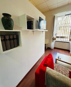 TV a/nebo společenská místnost v ubytování Apartamentos Templo Diana -Vistas Históricas-