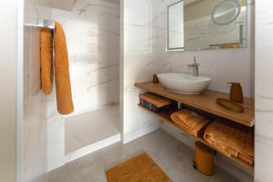 a bathroom with a sink and a mirror at Villa Bellevue in Sète +28 photos
