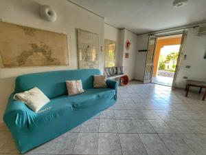 A seating area at Exclusive Riverside House in the Center of Bosa - Private Garden and Parking" Bosa Apartments