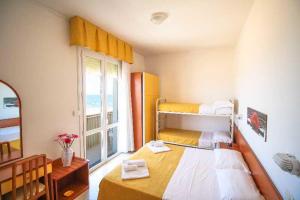 Postel nebo postele na pokoji v ubytování Hotel Carnaby