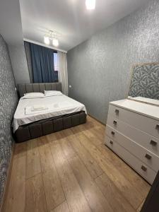 Ένα ή περισσότερα κρεβάτια σε δωμάτιο στο The best