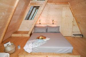 Postel nebo postele na pokoji v ubytování Glamping Fonte Murata