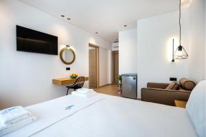a bedroom with a bed and a living room at Calma Living in Potos