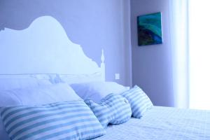 מיטה או מיטות בחדר ב-B&B Nannalia