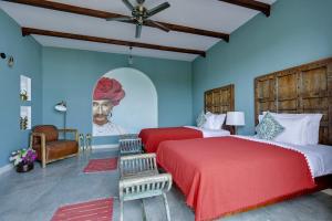 Voodi või voodid majutusasutuse Pushkar Fort - Luxury Heritage Resort toas