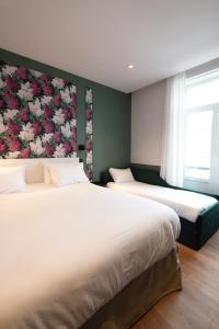Postel nebo postele na pokoji v ubytování Rosa Hotel