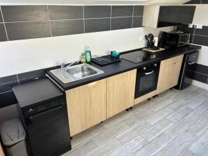 Η κουζίνα ή μικρή κουζίνα στο Maison Wallers 500m des mines +2 φωτογραφίες